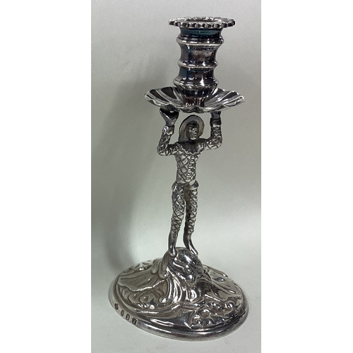 94 - A heavy cast Britannia Standard silver taperstick in the form of a harlequin. Approx. 176 grams. Est... 