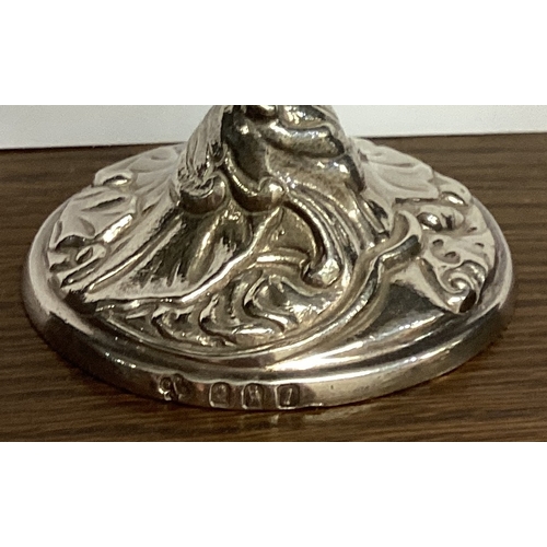 94 - A heavy cast Britannia Standard silver taperstick in the form of a harlequin. Approx. 176 grams. Est... 
