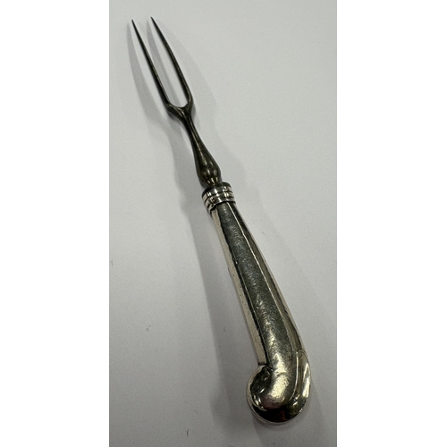 294 - An 18th Century silver-handled toy fork. Approx. 17 grams. Est. £50 - £80.