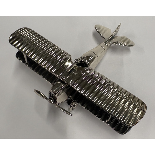 196 - A Continental silver model of an aeroplane. Approx. 111 grams. Est. £250 - £300.
