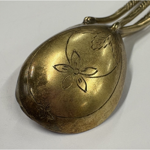 201 - A set of four Russian silver-gilt ice cream spoons with engraved floral decoration. Approx. 63 grams... 