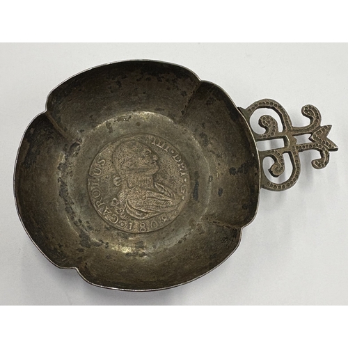 208 - A 19th Century Continental silver wine taster inset with coin to centre, dated 1808. Approx. 53 gram... 