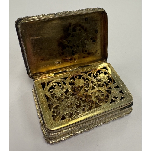 213 - A William IV silver-gilt vinaigrette with cast border. Birmingham 1830. By TM. Approx. 21 grams. Est... 