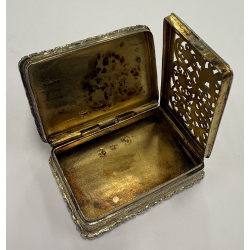 213 - A William IV silver-gilt vinaigrette with cast border. Birmingham 1830. By TM. Approx. 21 grams. Est... 