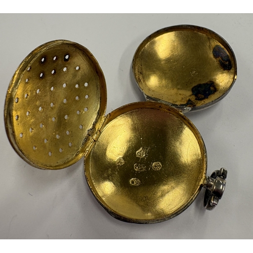 214 - An oval George III silver vinaigrette in the form of a watch case. Birmingham 1804. By Samuel Pember... 