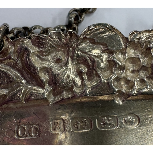 221 - A Victorian silver wine label for 'Brandy' with grape and vine decoration to border. Birmingham 1848... 