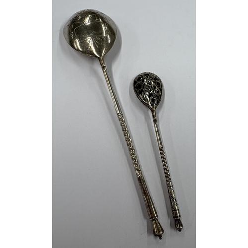 233 - Two Russian silver spoons with engraved decoration and twisted terminals. Approx. 43 grams. Est. £40... 