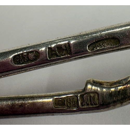 233 - Two Russian silver spoons with engraved decoration and twisted terminals. Approx. 43 grams. Est. £40... 