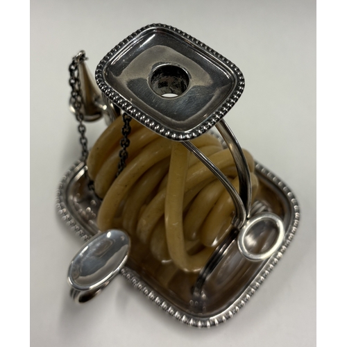 239 - An early 20th Century silver wax jack in the Georgian style. London 1910. By GH. Approx. 226 grams o... 