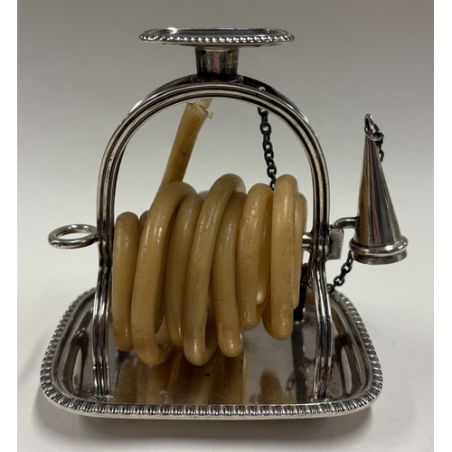 239 - An early 20th Century silver wax jack in the Georgian style. London 1910. By GH. Approx. 226 grams o... 