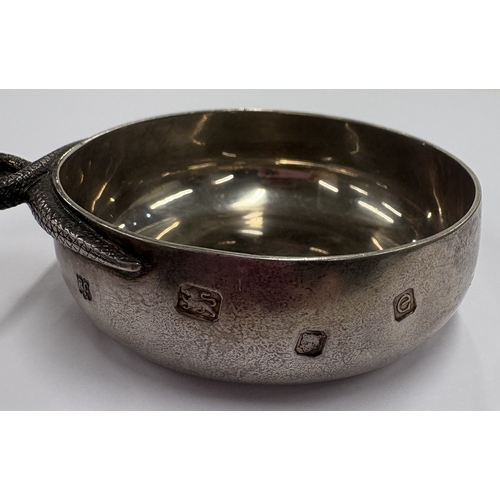 240 - A modernistic silver wine taster. London 2004. Approx. 78 grams. Est. £200 - £300.