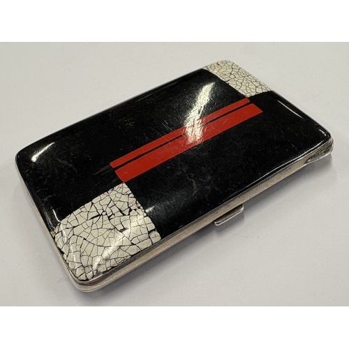 424 - A silver and red and white enamelled cigarette case, bearing import marks. Approx. 117 grams. Est. £... 