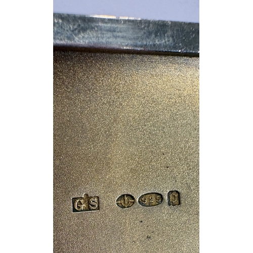 424 - A silver and red and white enamelled cigarette case, bearing import marks. Approx. 117 grams. Est. £... 