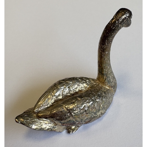 436 - A heavy silver figure of a swan with textured decoration. London. By SL. Approx. 49 grams. Est. £50 ... 