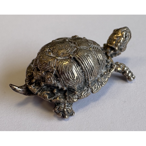 437 - A small Continental silver figure of a tortoise, marked to base. Approx. 25 grams. Est. £20 - £30.
