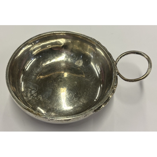 442 - An early-19th Century French silver wine taster. Circa 1810. Approx. 44 grams. Est. £200 - £300.
