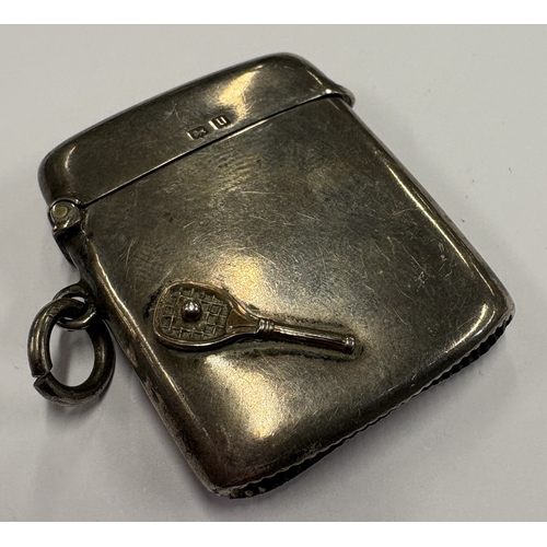 443 - A silver vesta case decorated with a tennis racket. Birmingham 1915. By TM & Co. Approx. 27 grams. E... 