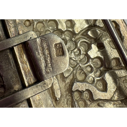 445 - A 19th Century Chinese export silver buckle with chased repousse decoration. Approx. 22 grams. Est. ... 