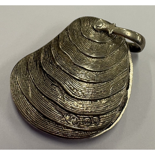 448 - A rare silver case with pivot mechanism in the form of a shell. London 1874. By Thomas Johnson. Appr... 