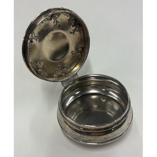 455 - A silver box with embossed decoration to hinged cover. Approx. 80 grams. Est. £80 - £120.