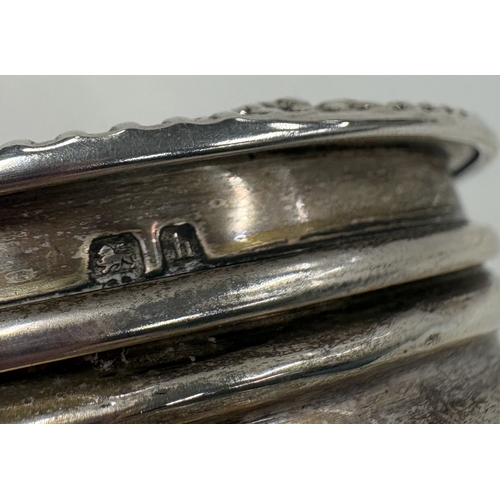 455 - A silver box with embossed decoration to hinged cover. Approx. 80 grams. Est. £80 - £120.