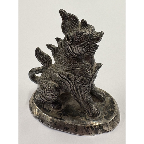 473 - A heavy Continental cast silver figure of a dragon. Approx. 121 grams. Est. £250 - £300.