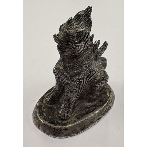 473 - A heavy Continental cast silver figure of a dragon. Approx. 121 grams. Est. £250 - £300.