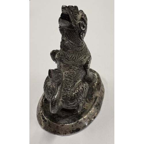 473 - A heavy Continental cast silver figure of a dragon. Approx. 121 grams. Est. £250 - £300.