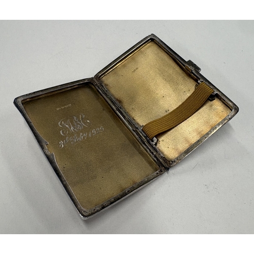 477 - An engine-turned Sterling silver cigarette case, bearing import marks to gilt interior. Approx. 79 g... 