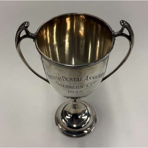 479 - A plain George V silver two-handled cup inscribed 'British Dental Association Southern Cup 1935'. Lo... 