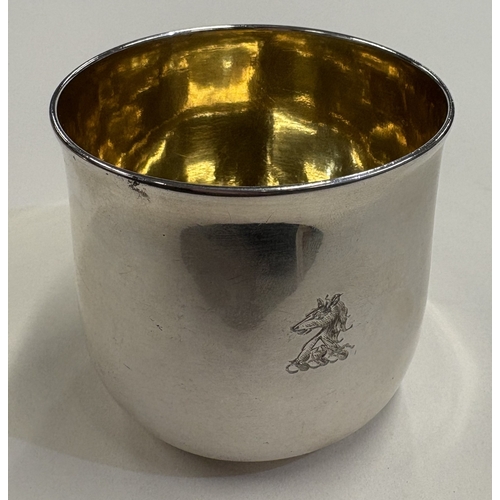 542 - A George II silver tumbler cup with crested decoration and gilt interior. London 1759. By Thomas Whi... 