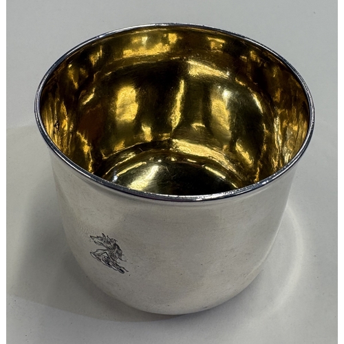 542 - A George II silver tumbler cup with crested decoration and gilt interior. London 1759. By Thomas Whi... 