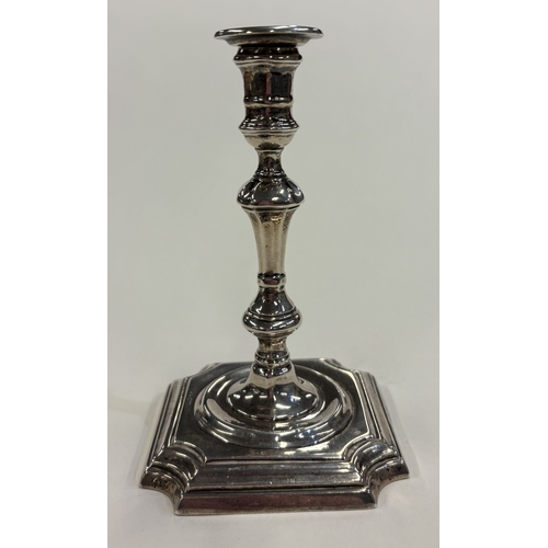 543 - A silver taperstick on square base. London. By TS. Approx. 136 grams of gross weight. Est. £100 - £1... 