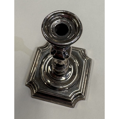 543 - A silver taperstick on square base. London. By TS. Approx. 136 grams of gross weight. Est. £100 - £1... 