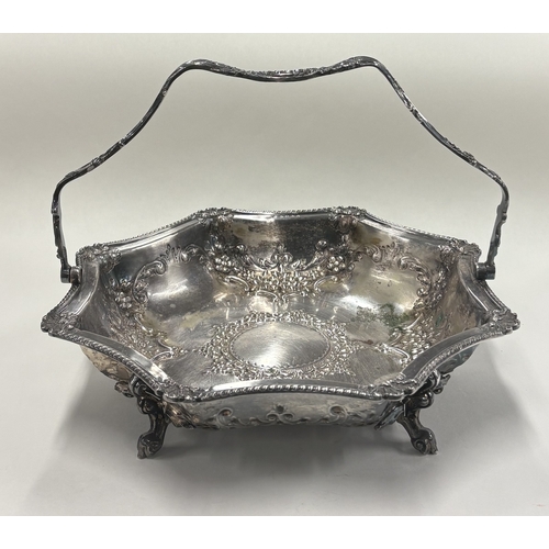 544 - A silver-plated swing-handled basket. Est. £10 - £20.