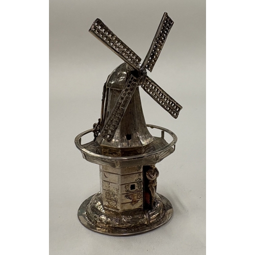 561 - A silver model of a Dutch windmill. Approx. 35 grams. Est. £30 - £40.