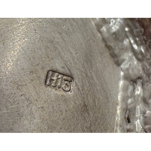 561 - A silver model of a Dutch windmill. Approx. 35 grams. Est. £30 - £40.