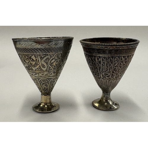 562 - A matched pair of Continental silver goblets with engraved decoration. Approx. 95 grams. Est. £80 - ... 