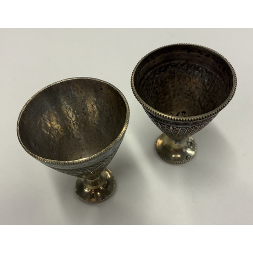 562 - A matched pair of Continental silver goblets with engraved decoration. Approx. 95 grams. Est. £80 - ... 