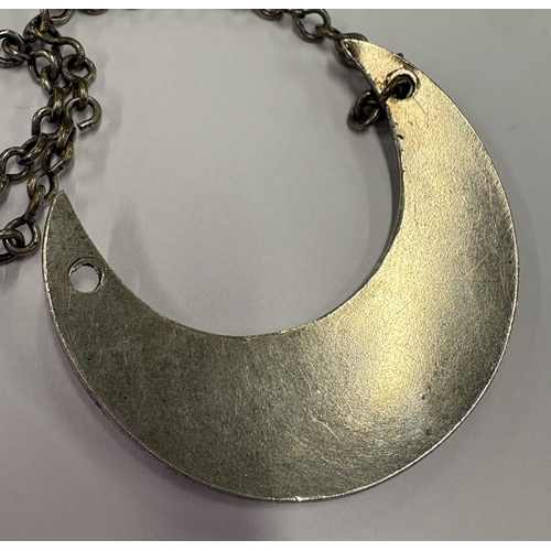 571 - A crescent-shaped early 19th Century silver wine label for 'Curacoa'. Approx. 10 grams. Est. £40 - £... 