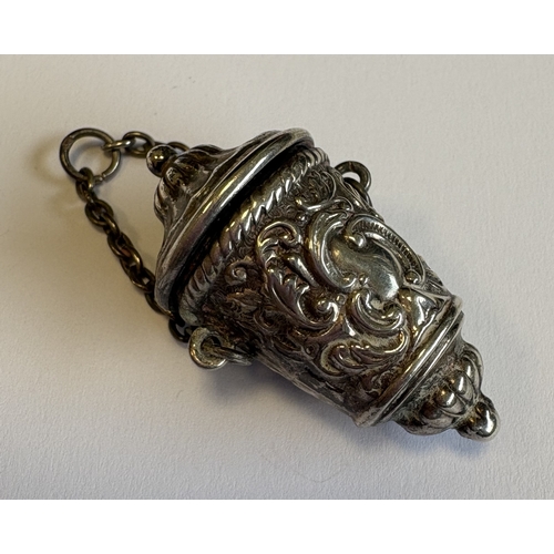 581 - A Victorian silver chatelaine thimble case with chased decoration. Approx. 11 grams. Est. £20 - £30.