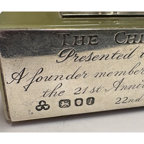 584 - A silver figure of a jockey on rectangular base inscribed 'The Chichester 12', presented to 'JDM Bri... 