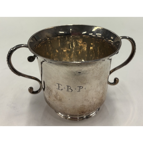 588 - A Channel Islands George I silver porringer, maker's mark only to base. Guernsey, circa 1720. By IH.... 