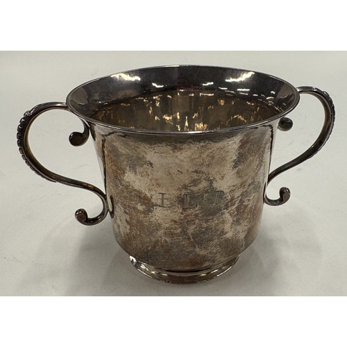 588 - A Channel Islands George I silver porringer, maker's mark only to base. Guernsey, circa 1720. By IH.... 
