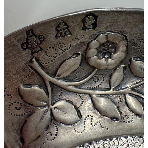 592 - A 19th Century Continental silver wine taster with embossed decoration, marked to interior. Approx. ... 