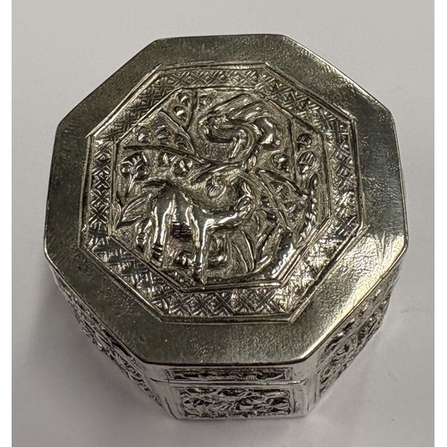 594 - A chased Chinese export silver snuff box with hinged cover, marked to base. Approx. 29 grams. Est. £... 