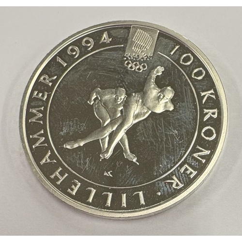 596 - An Olympic silver coin. Approx. 32 grams. Est. £60 - £80.