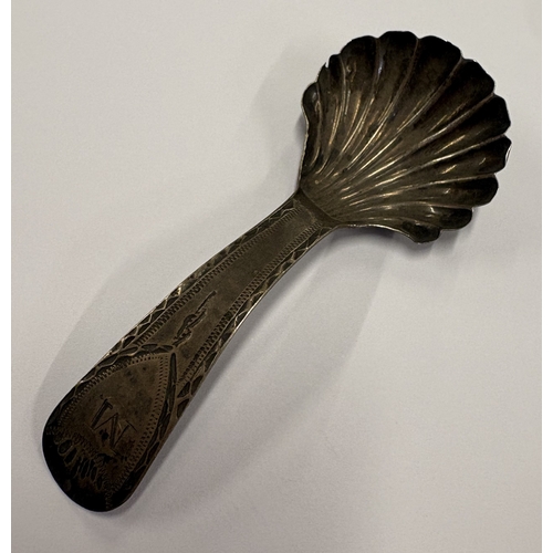 677 - NEWCASTLE: A rare Provincial silver caddy spoon with fluted decoration. Circa 1790. Approx. 12 grams... 