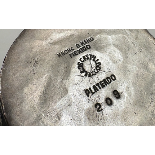 678 - A silver-plated jug with handle in the form of a bird. Est. £30 - £40.