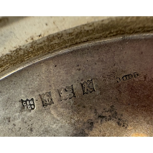 696 - A silver pin dish together with a napkin ring etc. Various dates and makers. Approx. 77 grams. Est. ... 